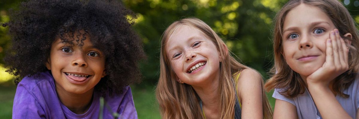 front-view-smiley-kids-outside